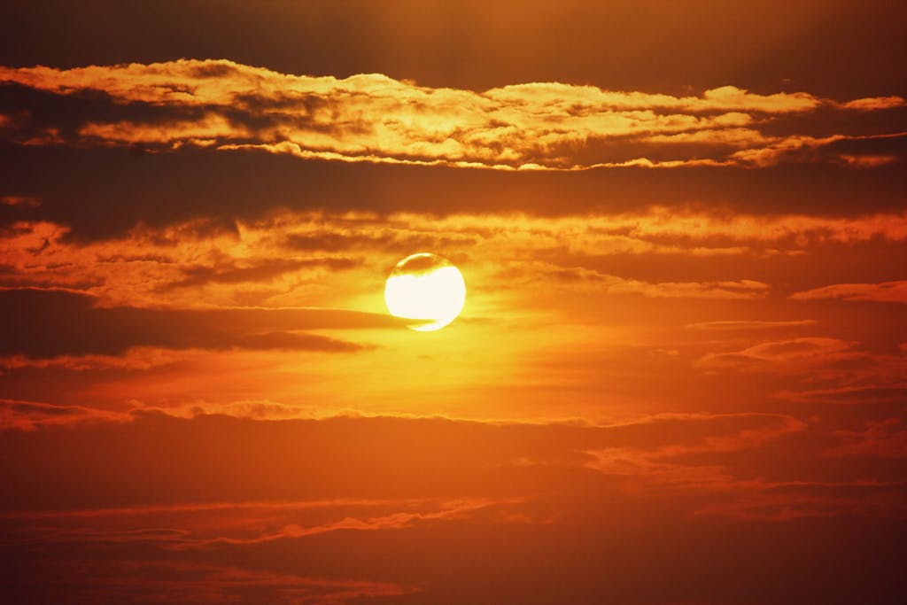 A breathtaking golden sunset with dramatic clouds in Thrissur, India.